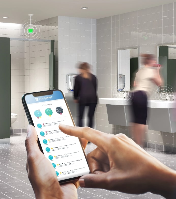 Person on PlumbSmart app in a commercial restroom.